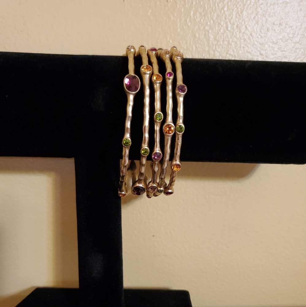 Set of 5 hammered gold tone bangles
